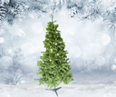 Green artificial Christmas tree against a snowy background with pine branches.