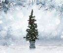 Decorated Christmas tree in a snowy landscape with blurred snowflakes