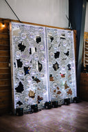 Decorative wall panels with mirror and light effects in a room setting.