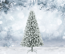 Frost-covered artificial Christmas tree in a snowy landscape with blurred trees in the background