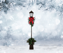 Decorative street lamp with a red bow in a snowy landscape