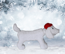 White dog figure with a red hat on a snowy background